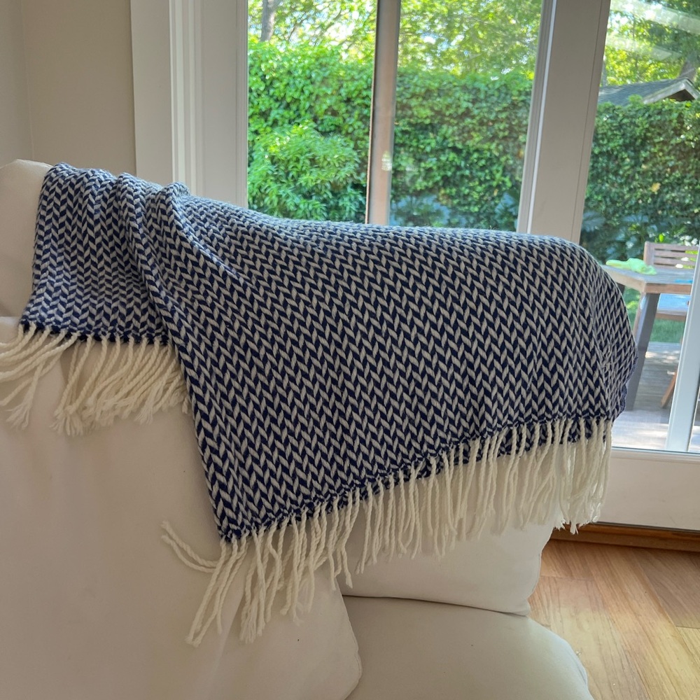 West Elm soft Navy and White Fringe Throw Blanket with embroidered “H” emblem